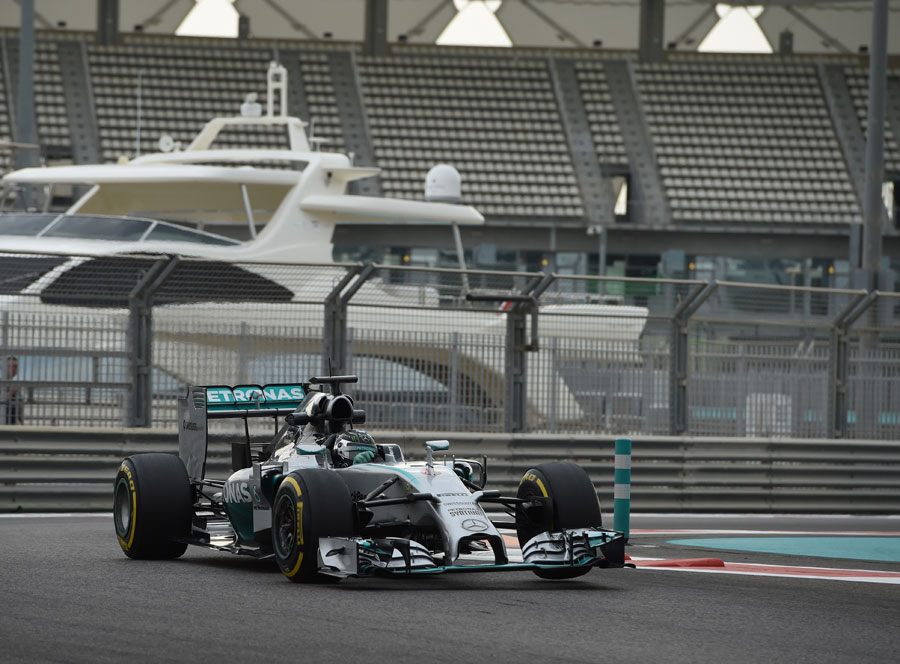 Nico Rosberg attacks the kerbs during testing