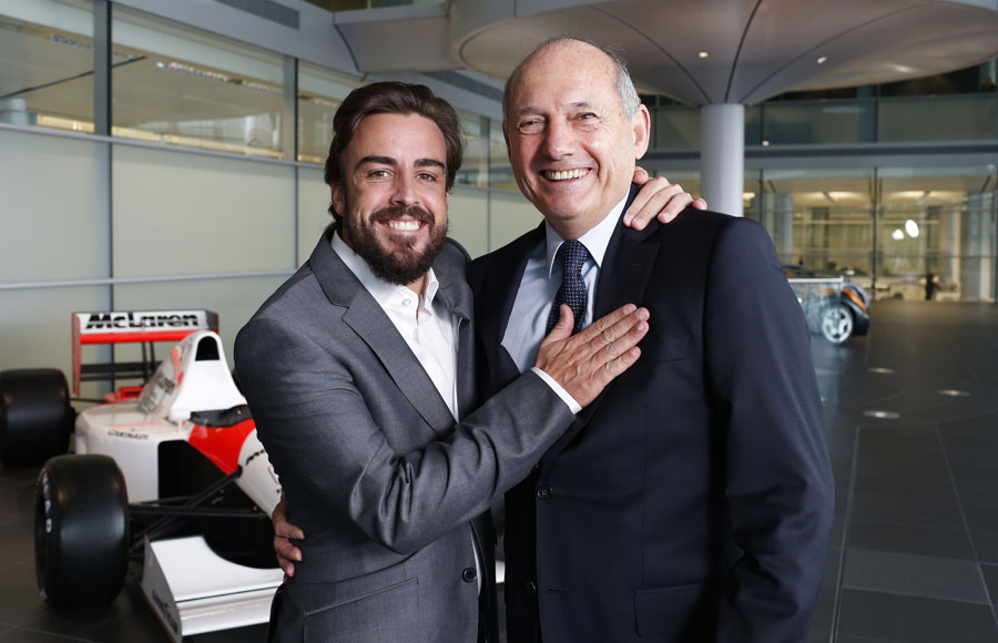 New McLaren signing Fernando Alonso poses with CEO Ron Dennis