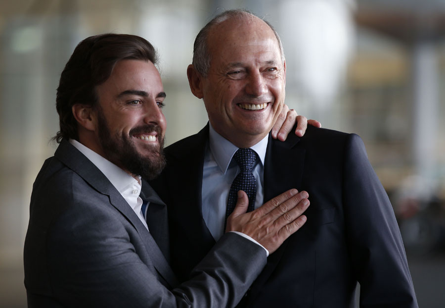 New McLaren signing Fernando Alonso poses with CEO Ron Dennis