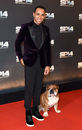 Lewis Hamilton and his dog Roscoe pose for the cameras ahead of the BBC Sports Personality of the Year award ceremony