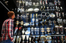 Sebastian Vettel looks at Red Bull's trophy cabinet in Milton Keynes during his farewell to the team