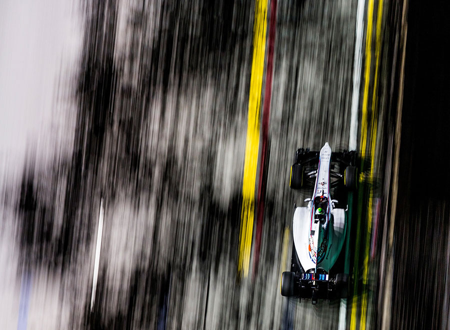 Felipe Massa races under the spotlights