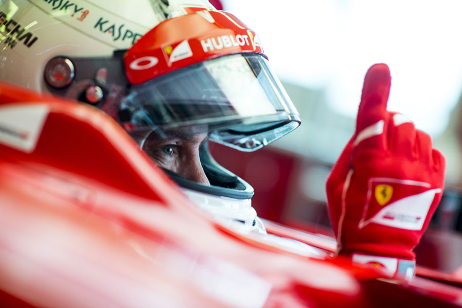 Sebastian Vettel asks his engineers to fire up his Ferrari
