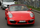 Ex-F1 driver Mark Webber gives Maria Sharapova a lift through the streets of Melbourne to tennis practice in a Porsche 911