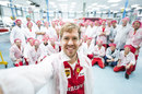 Sebastian Vettel takes a selfie in front of his new Ferrari colleagues during a Maranello visit