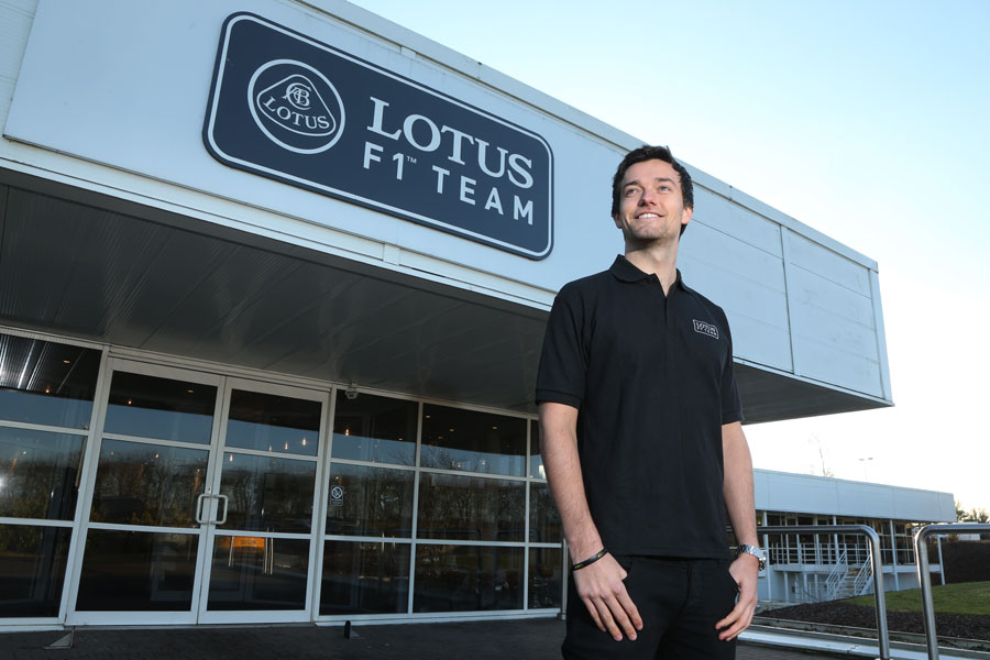 Jolyon Palmer poses at Lotus after being named the team's third driver