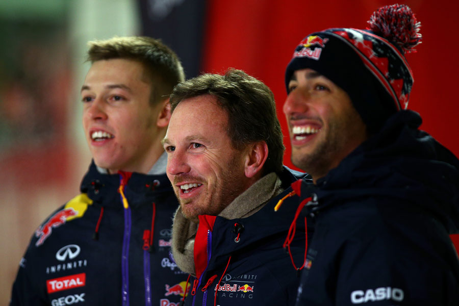 Red Bull boss Christian Horner poses with team drivers Daniil Kvyat and Daniel Ricciardo at a media event in Milton Keynes