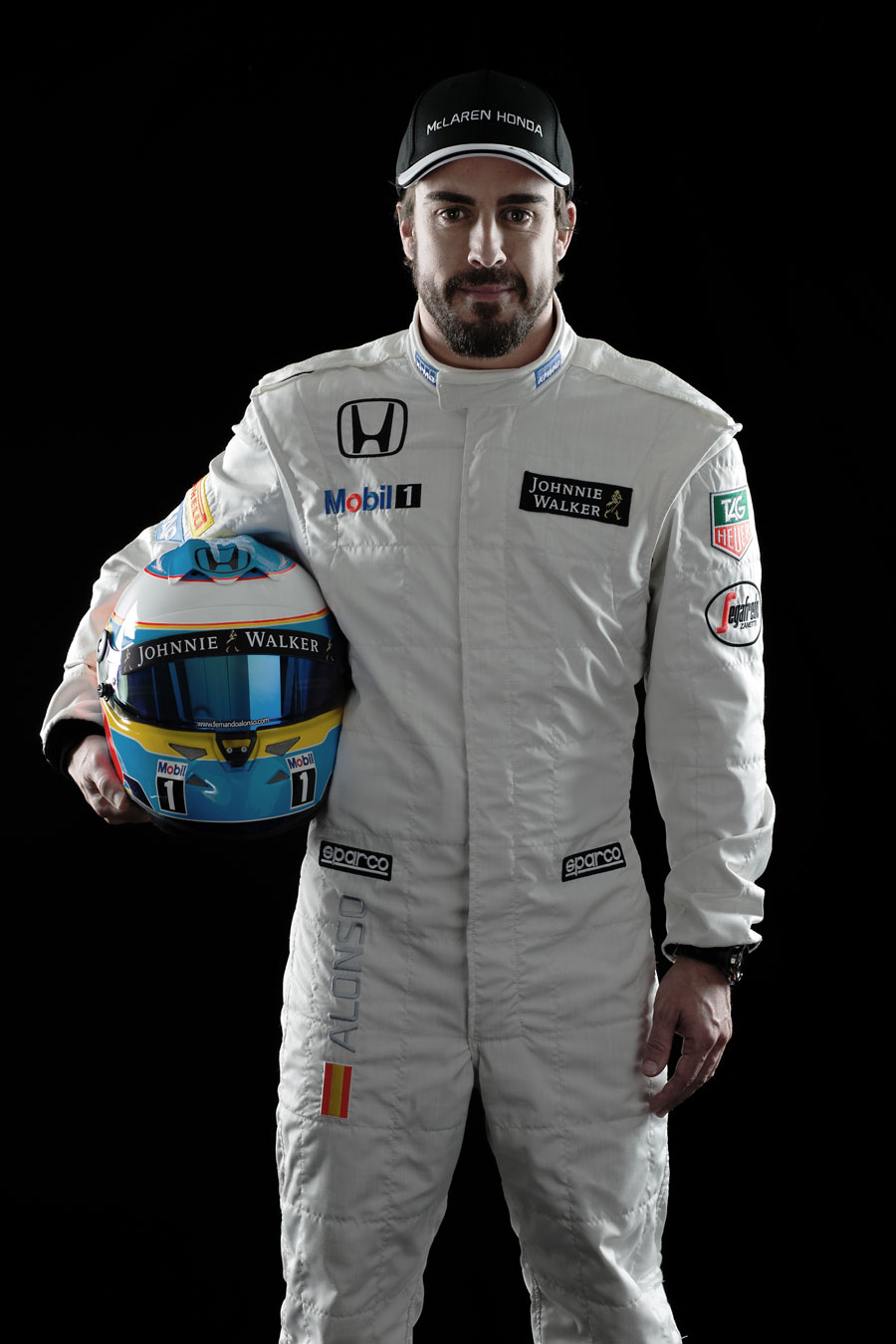 Fernando Alonso poses for a photo in his new McLaren overalls