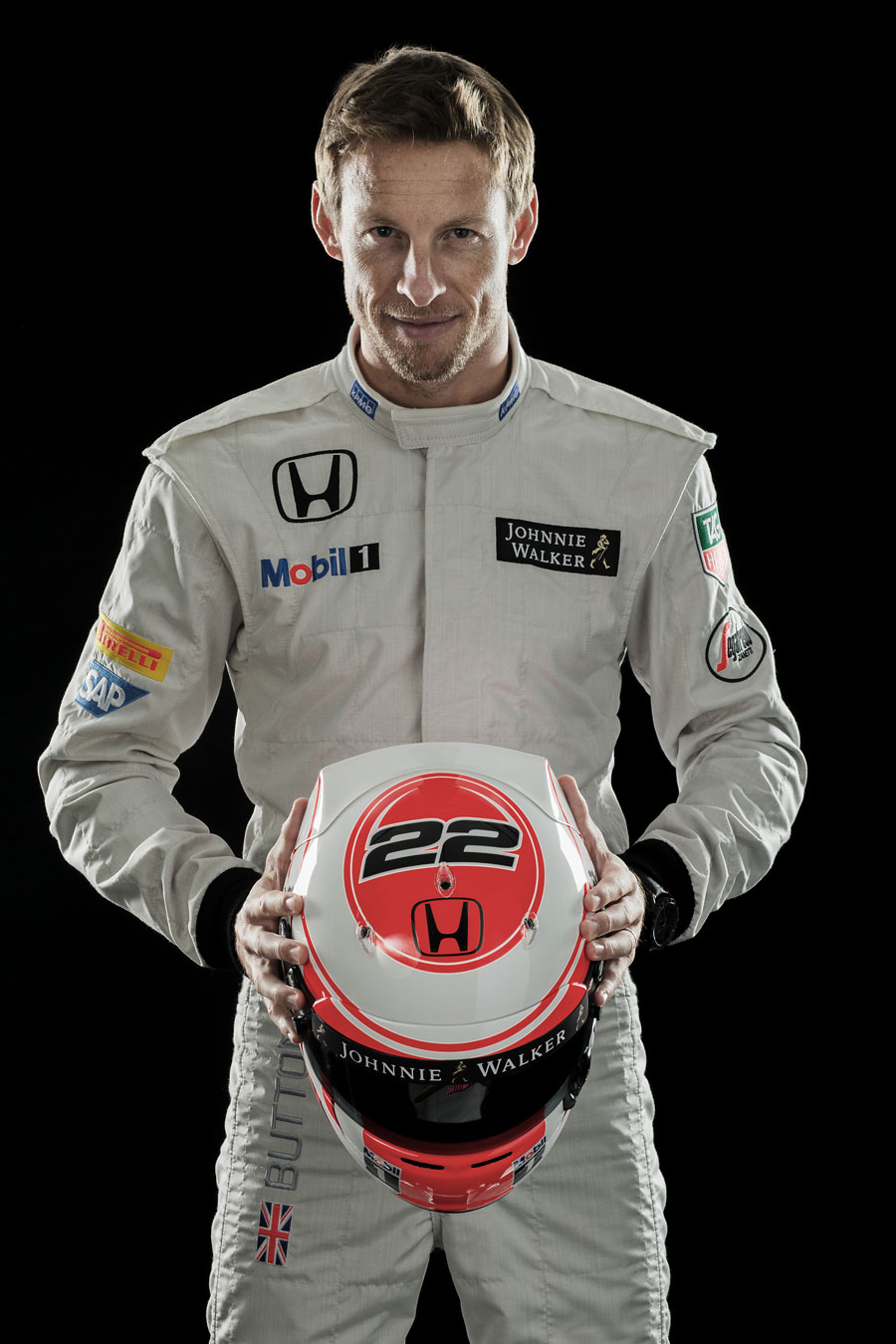 Jenson Button shows off his helmet
