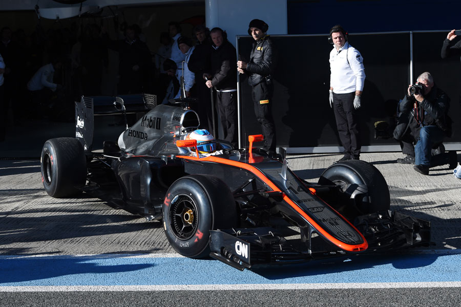 Fernando Alonso pulls out of the McLaren garage for his first run in the MP4-30