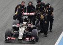 The broken down Lotus E23 of Pastor Maldonado is wheeled back to the pits on Monday