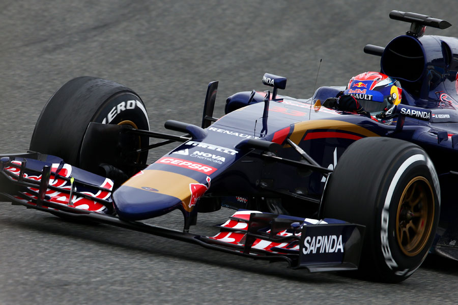 Max Verstappen turns in behind the STR10