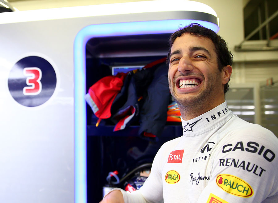 Daniel Ricciardo displays his famous grin in the Red Bull garage