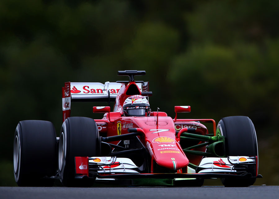 Kimi Raikkonen in a Ferrari covered in aero flo-vis paint