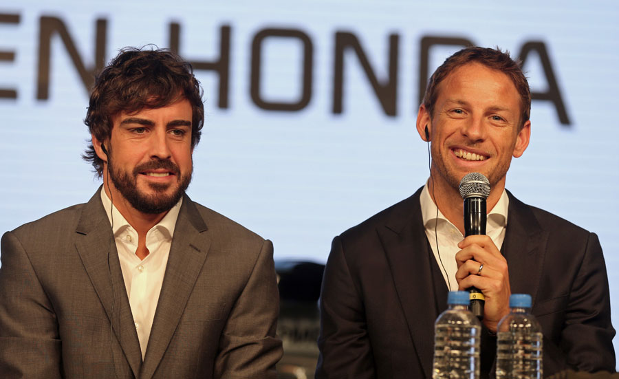 McLaren team-mates Fernando Alonso and Jenson Button speak to the press