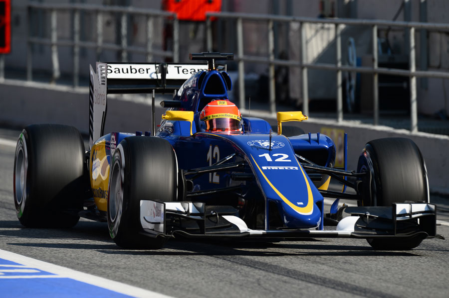 Felipe Nasr drives through the pit lane in the Sauber