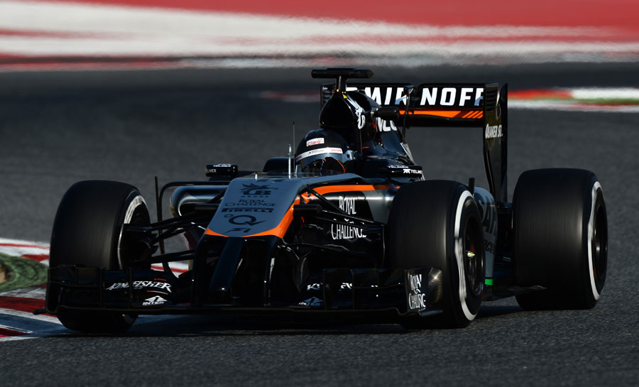Sergio Perez, donning a plain helmet for testing, on track in the 2014 Force India