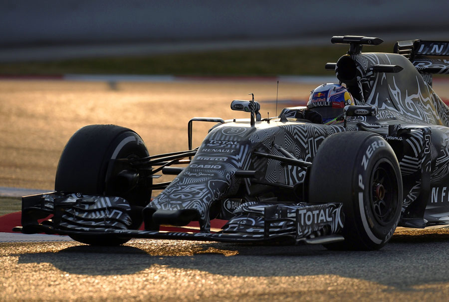 Daniel Ricciardo on track in the dimming evening light