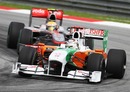 Adrian Sutil holds off Lewis Hamilton