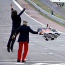 Ferrari boss Luca di Montezemolo jumps for joy as Niki Lauda crosses the finish line