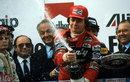 Race winner Didier Pironi sprays the champagne