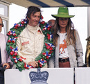 Jochen Rindt celebrates a hat trick of victories on the podium