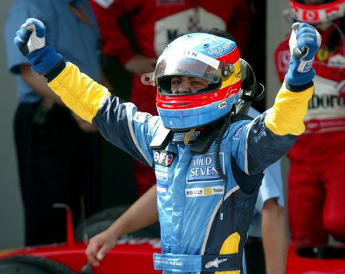 Fernando Alonso celebrates after taking second place