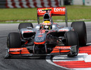 Lewis Hamilton hits the apex in his McLaren