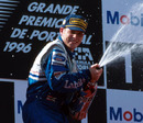 Jacques Villeneuve celebrates his race win
