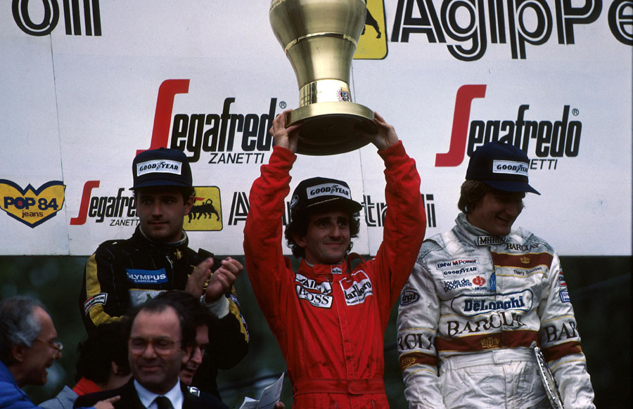 Winner Alain Prost, second-placed Elio de Angelis and third-placed Thierry Boutsen 