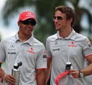 Lewis Hamilton and Jenson Button arrive at Sepang