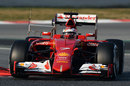 Kimi Raikkonen rounds the apex in the Ferrari