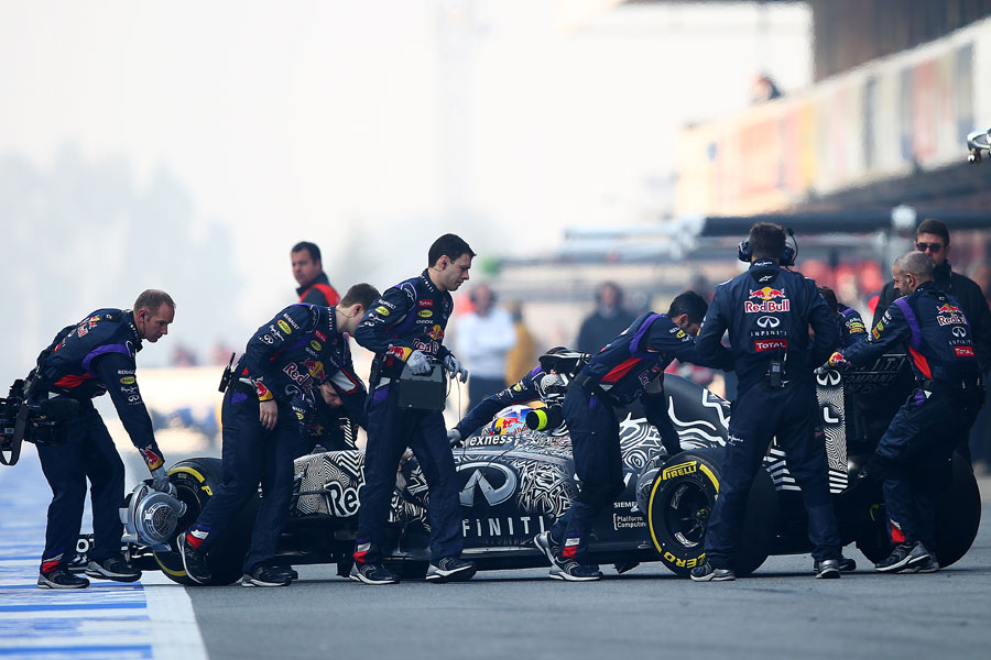 Daniel Ricciardo's RB11 is wheeled back into the Red Bull garage
