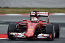 Sebastian Vettel rounds the apex in his Ferrari