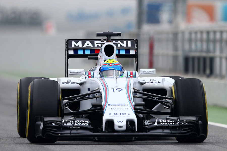 Felipe Massa drives the Williams through the pit lane