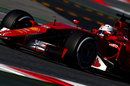 Sebastian Vettel at speed in the Ferrari SF15-T