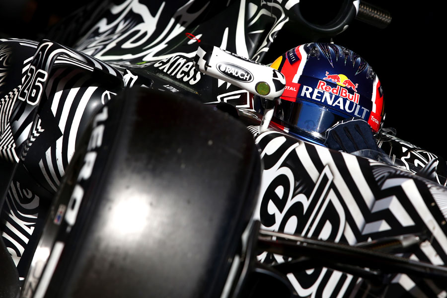 A close up of Daniil Kvyat in the Red Bull cockpit