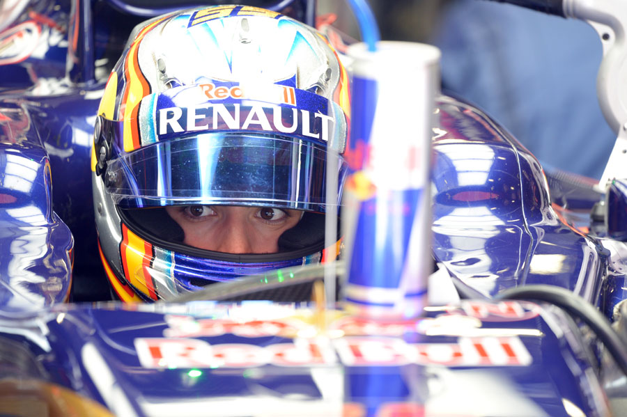 Carlos Sainz Jr looks on from the Toro Rosso cockpit