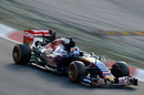 Carlos Sainz comes through Turn 1 with an aero sensor on his Toro Rosso