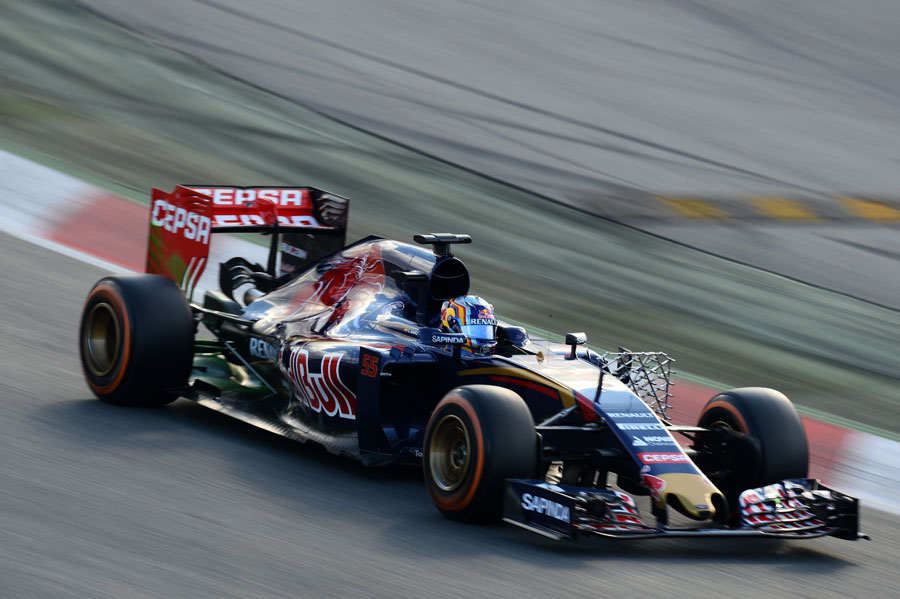Carlos Sainz comes through Turn 1 with an aero sensor on his Toro Rosso