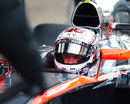 Kevin Magnussen looks on from the cockpit of the McLaren MP4-30