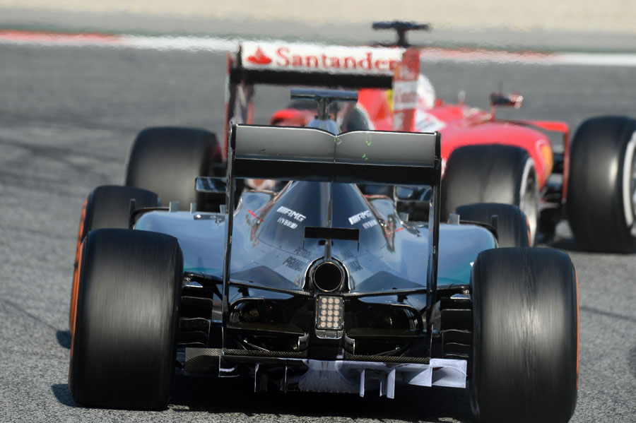 Nico Rosberg stalks the Ferrari of Sebastian Vettel 