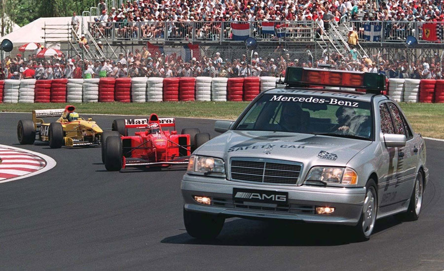 The safety car leads Michael Schumacher