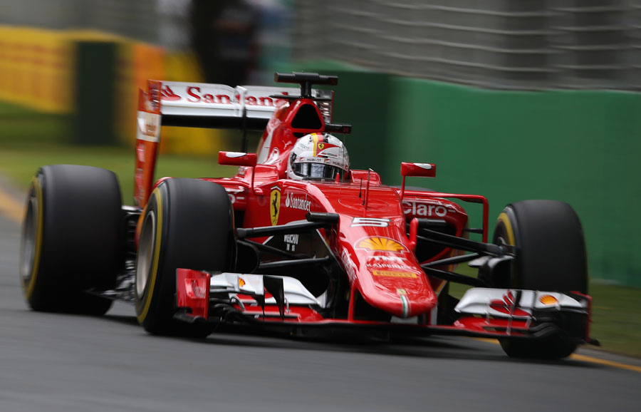 Sebastian Vettel powers down towards Turn 3