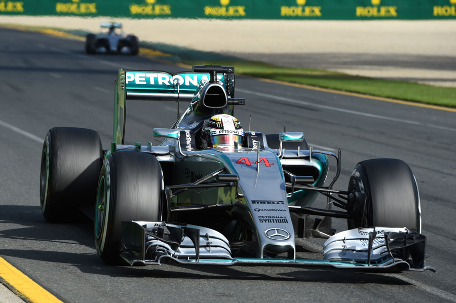 Lewis Hamilton approaches the penultimate corner with Nico Rosberg in the distance