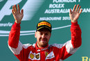 Sebastian Vettel celebrates securing a podium on his Ferrari debut