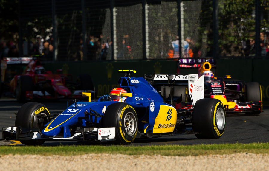Felipe Nasr rounds Turn 3 with Daniel Ricciardo and Kimi Raikkonen in close company
