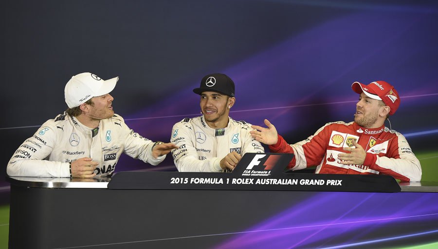 Nico Rosberg and Sebastian Vettel share a joke at the post-race press conference