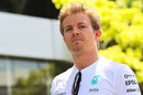 Nico Rosberg walks through the Sepang paddock