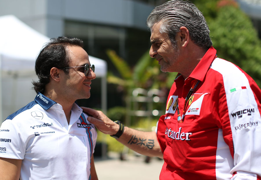 Felipe Massa speaks to Ferrari team boss Maurizio Arrivabene 